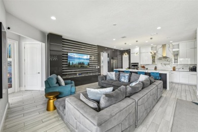 Welcome to 13136 Alderley Drive - a luxurious 5-bedroom, 5-bath on Eagle Creek Golf Club in Florida - for sale on GolfHomes.com, golf home, golf lot