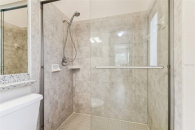 Location, Location - Tampa Palms beauty. This 4/3/2 plus a den on Tampa Palms Golf and Country Club in Florida - for sale on GolfHomes.com, golf home, golf lot