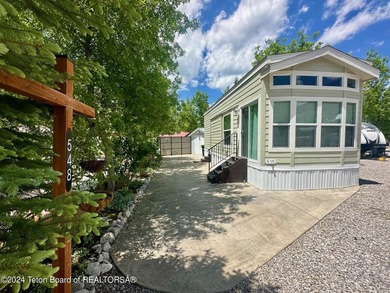 Beautifully maintained, immaculate 2022 CAVCO unit in the Star on Star Valley RV Golf Course in Wyoming - for sale on GolfHomes.com, golf home, golf lot