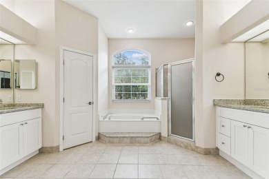 Location, Location - Tampa Palms beauty. This 4/3/2 plus a den on Tampa Palms Golf and Country Club in Florida - for sale on GolfHomes.com, golf home, golf lot