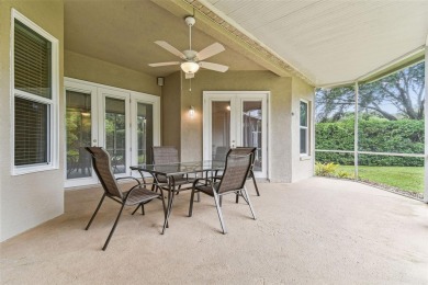 Location, Location - Tampa Palms beauty. This 4/3/2 plus a den on Tampa Palms Golf and Country Club in Florida - for sale on GolfHomes.com, golf home, golf lot