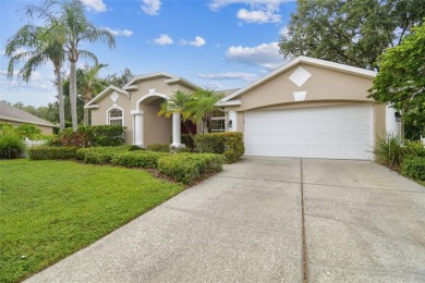 Location, Location - Tampa Palms beauty. This 4/3/2 plus a den on Tampa Palms Golf and Country Club in Florida - for sale on GolfHomes.com, golf home, golf lot