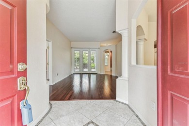 Location, Location - Tampa Palms beauty. This 4/3/2 plus a den on Tampa Palms Golf and Country Club in Florida - for sale on GolfHomes.com, golf home, golf lot