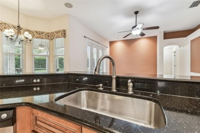Location, Location - Tampa Palms beauty. This 4/3/2 plus a den on Tampa Palms Golf and Country Club in Florida - for sale on GolfHomes.com, golf home, golf lot