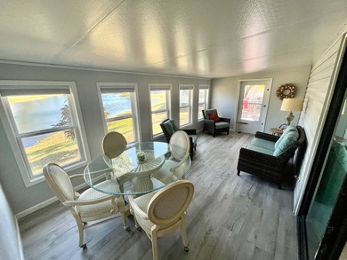 Stunning, move-in-ready manufactured home on leased land-nothing on Pine Lakes Country Club in Florida - for sale on GolfHomes.com, golf home, golf lot