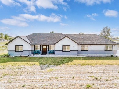 This stunning 4 bed, 2 bath home sits on a  1-acre corner lot on Spring Creek Golf Course in Nevada - for sale on GolfHomes.com, golf home, golf lot