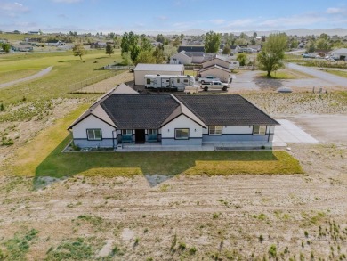 This stunning 4 bed, 2 bath home sits on a  1-acre corner lot on Spring Creek Golf Course in Nevada - for sale on GolfHomes.com, golf home, golf lot