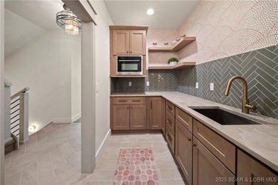 Experience luxury in this stunning 5,500 sq ft home that blends on The Club At Porto Cima in Missouri - for sale on GolfHomes.com, golf home, golf lot