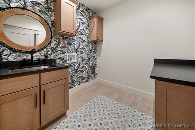 Experience luxury in this stunning 5,500 sq ft home that blends on The Club At Porto Cima in Missouri - for sale on GolfHomes.com, golf home, golf lot