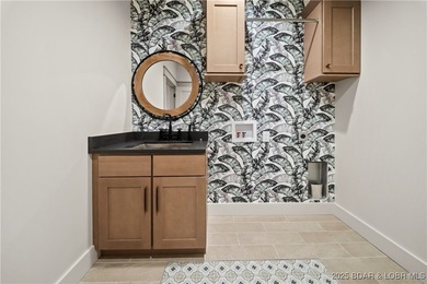 Experience luxury in this stunning 5,500 sq ft home that blends on The Club At Porto Cima in Missouri - for sale on GolfHomes.com, golf home, golf lot