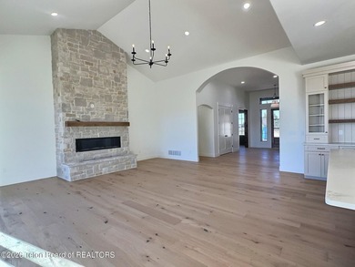 This home perfectly blends luxury with practicality. It offers a on Teton Reserve in Idaho - for sale on GolfHomes.com, golf home, golf lot