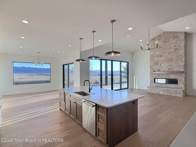 This home perfectly blends luxury with practicality. It offers a on Teton Reserve in Idaho - for sale on GolfHomes.com, golf home, golf lot
