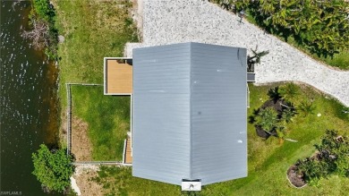 Welcome to this newly renovated luxury lakeside retreat on The Dunes Golf and Tennis Club in Florida - for sale on GolfHomes.com, golf home, golf lot