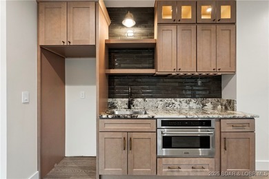 Experience luxury in this stunning 5,500 sq ft home that blends on The Club At Porto Cima in Missouri - for sale on GolfHomes.com, golf home, golf lot