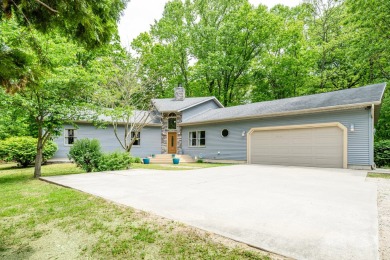 Nestled in a quiet cul-de-sac, this beautifully updated on Point O Woods Country Club in Michigan - for sale on GolfHomes.com, golf home, golf lot