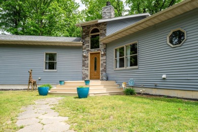 Nestled in a quiet cul-de-sac, this beautifully updated on Point O Woods Country Club in Michigan - for sale on GolfHomes.com, golf home, golf lot