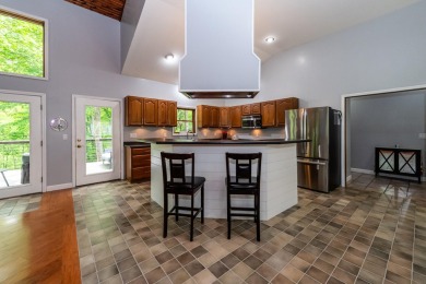 Nestled in a quiet cul-de-sac, this beautifully updated on Point O Woods Country Club in Michigan - for sale on GolfHomes.com, golf home, golf lot
