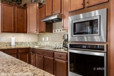 Stunning 2-bedroom + den home located on the 5th hole of the on The Oasis Golf Club in Nevada - for sale on GolfHomes.com, golf home, golf lot