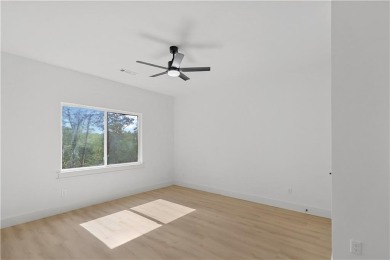 Discover modern living at its finest at 85 Rountree, located on Bella Vista Country Club - Berksdale in Arkansas - for sale on GolfHomes.com, golf home, golf lot