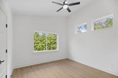 Discover modern living at its finest at 85 Rountree, located on Bella Vista Country Club - Berksdale in Arkansas - for sale on GolfHomes.com, golf home, golf lot