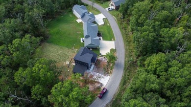Discover modern living at its finest at 85 Rountree, located on Bella Vista Country Club - Berksdale in Arkansas - for sale on GolfHomes.com, golf home, golf lot