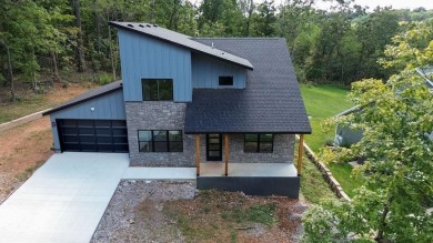 Discover modern living at its finest at 85 Rountree, located on Bella Vista Country Club - Berksdale in Arkansas - for sale on GolfHomes.com, golf home, golf lot
