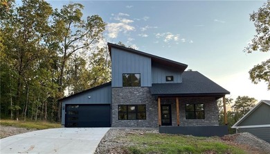 Discover modern living at its finest at 85 Rountree, located on Bella Vista Country Club - Berksdale in Arkansas - for sale on GolfHomes.com, golf home, golf lot