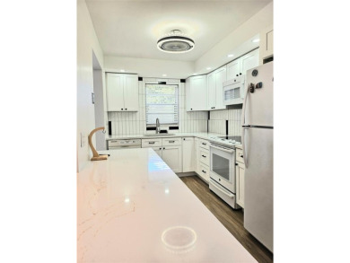 Welcome to this beautifully renovated 2-bedroom, 2-bathroom on Inverrary Country Club in Florida - for sale on GolfHomes.com, golf home, golf lot