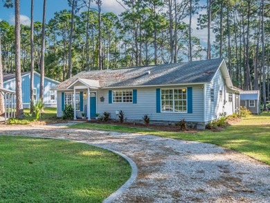 Beautifully maintained 3BR/2BA coastal home on over half an acre on St. James Bay in Florida - for sale on GolfHomes.com, golf home, golf lot