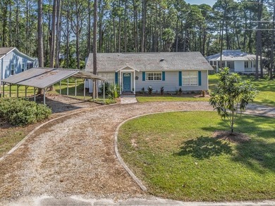 Beautifully maintained 3BR/2BA coastal home on over half an acre on St. James Bay in Florida - for sale on GolfHomes.com, golf home, golf lot