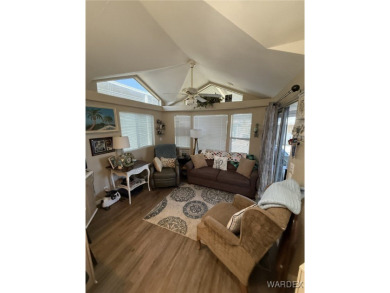 Charming home with versatile Arizona room has a completely on Riverview Golf Course in Arizona - for sale on GolfHomes.com, golf home, golf lot