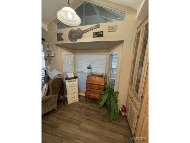 Charming home with versatile Arizona room has a completely on Riverview Golf Course in Arizona - for sale on GolfHomes.com, golf home, golf lot