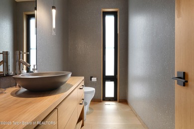 Perfectly positioned on one of the most breathtaking vantage on Jackson Hole Golf and Tennis Club in Wyoming - for sale on GolfHomes.com, golf home, golf lot