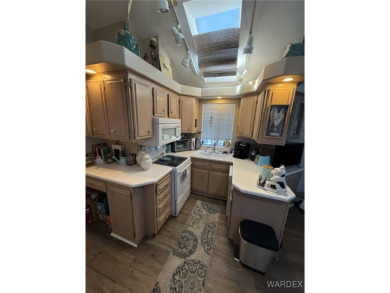 Charming home with versatile Arizona room has a completely on Riverview Golf Course in Arizona - for sale on GolfHomes.com, golf home, golf lot