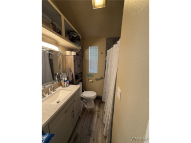 Charming home with versatile Arizona room has a completely on Riverview Golf Course in Arizona - for sale on GolfHomes.com, golf home, golf lot