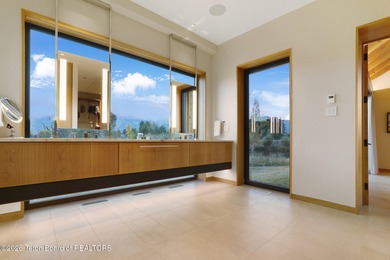 Perfectly positioned on one of the most breathtaking vantage on Jackson Hole Golf and Tennis Club in Wyoming - for sale on GolfHomes.com, golf home, golf lot