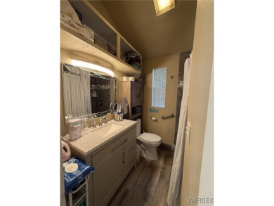 Charming home with versatile Arizona room has a completely on Riverview Golf Course in Arizona - for sale on GolfHomes.com, golf home, golf lot