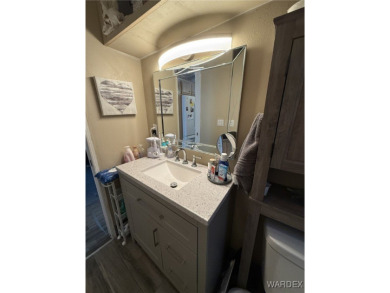 Charming home with versatile Arizona room has a completely on Riverview Golf Course in Arizona - for sale on GolfHomes.com, golf home, golf lot