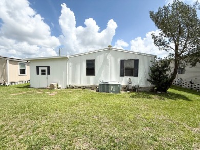PRICED TO SELL!!! This 2-bedroom, 2 full bath home needs someone on Grasslands Golf and Country Club in Florida - for sale on GolfHomes.com, golf home, golf lot