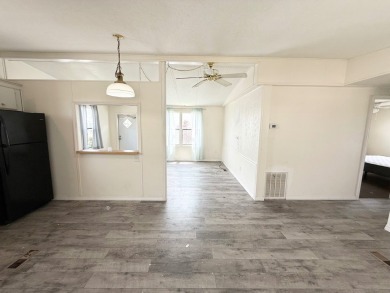 PRICED TO SELL!!! This 2-bedroom, 2 full bath home needs someone on Grasslands Golf and Country Club in Florida - for sale on GolfHomes.com, golf home, golf lot