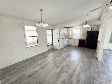 PRICED TO SELL!!! This 2-bedroom, 2 full bath home needs someone on Grasslands Golf and Country Club in Florida - for sale on GolfHomes.com, golf home, golf lot