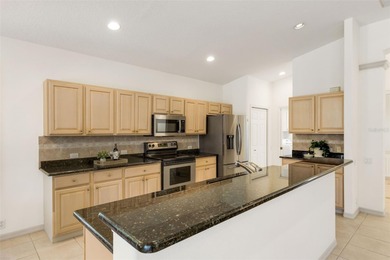 POOLSIDE PARADISE IN RIVER CLUB! Enjoy maintenance-free living on The River Club in Florida - for sale on GolfHomes.com, golf home, golf lot