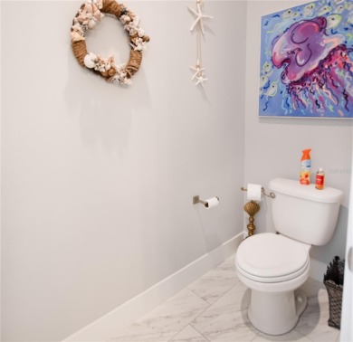 The ultimate saltwater lifestyle awaits in this like-new 2021 on Palm Harbor Golf Club in Florida - for sale on GolfHomes.com, golf home, golf lot