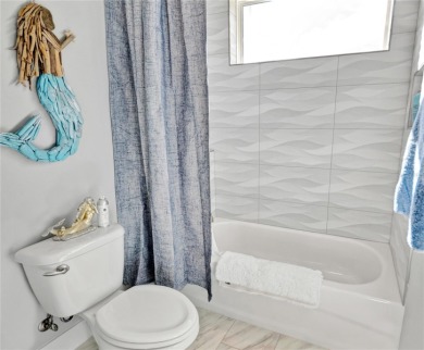 The ultimate saltwater lifestyle awaits in this like-new 2021 on Palm Harbor Golf Club in Florida - for sale on GolfHomes.com, golf home, golf lot
