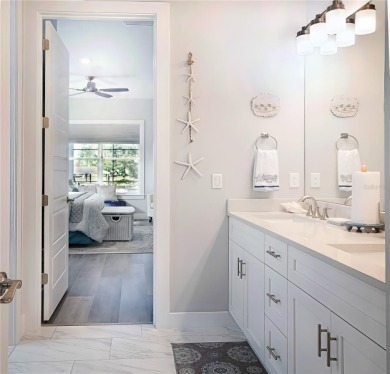 The ultimate saltwater lifestyle awaits in this like-new 2021 on Palm Harbor Golf Club in Florida - for sale on GolfHomes.com, golf home, golf lot
