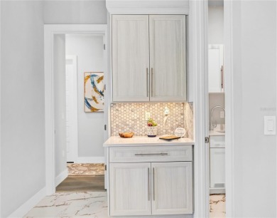 The ultimate saltwater lifestyle awaits in this like-new 2021 on Palm Harbor Golf Club in Florida - for sale on GolfHomes.com, golf home, golf lot