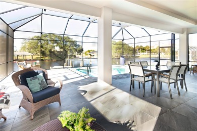 The ultimate saltwater lifestyle awaits in this like-new 2021 on Palm Harbor Golf Club in Florida - for sale on GolfHomes.com, golf home, golf lot
