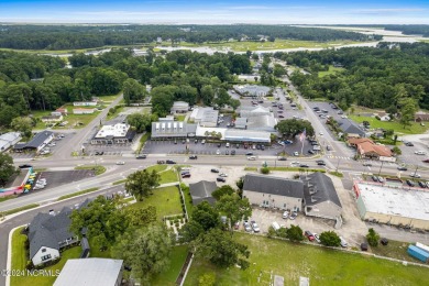 Start living your best life at the coast! This low-maintenance on Crow Creek Golf Club in North Carolina - for sale on GolfHomes.com, golf home, golf lot