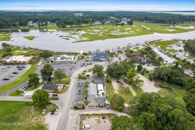 Start living your best life at the coast! This low-maintenance on Crow Creek Golf Club in North Carolina - for sale on GolfHomes.com, golf home, golf lot