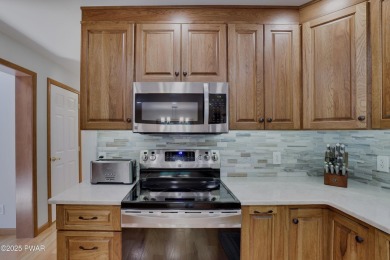 Meticulously maintained log-sided lakefront on TinkWig Lake with on Woodloch Springs Country Club in Pennsylvania - for sale on GolfHomes.com, golf home, golf lot